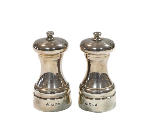 Lot 636 - A pair of Elizabeth II silver condiment grinders