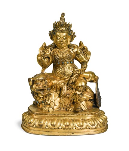 Lot 427 - A Sino-Tibetan style gilt bronze figure of Vaishravana