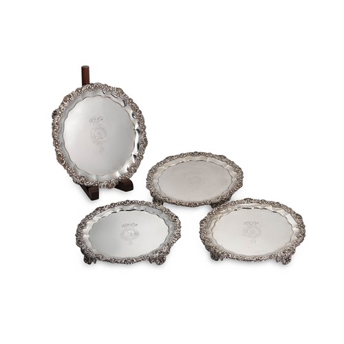 Lot 524 - A set of four George IV silver waiters, mark of John Bridge