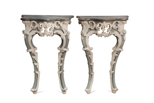 Lot 514 - A pair of carved and painted pine console tables