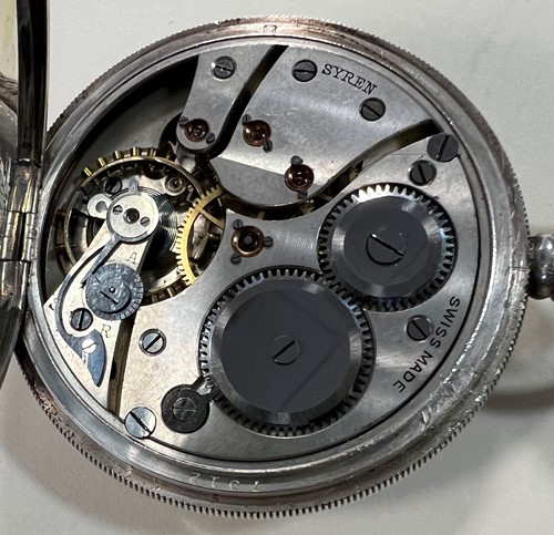 Lot 264 - Syren, Geneve - A George V Sterling silver half hunter pocket watch and chain with 2 fob medals
