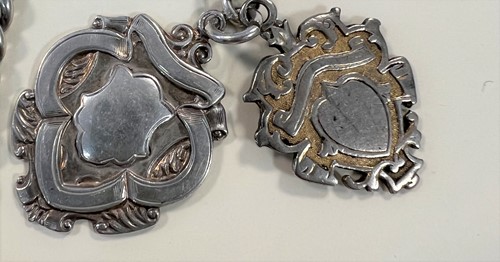 Lot 264 - Syren, Geneve - A George V Sterling silver half hunter pocket watch and chain with 2 fob medals