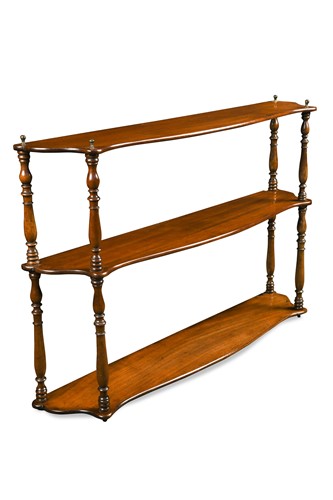Lot 597 - A set of Regency serpentine mahogany hanging shelves