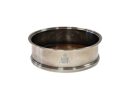 Lot 632 - An Elizabeth II silver bottle coaster, mark of Asprey & Co.