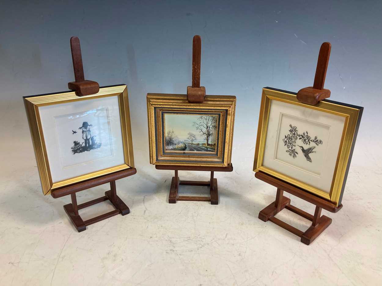 Lot 44 - Two small modern cut paper silhouette pictures...