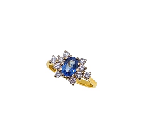 Lot 189 - An 18ct gold sapphire and diamond cluster ring