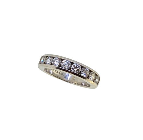 Lot 214 - Tiffany & Co - A diamond set half hoop style ring