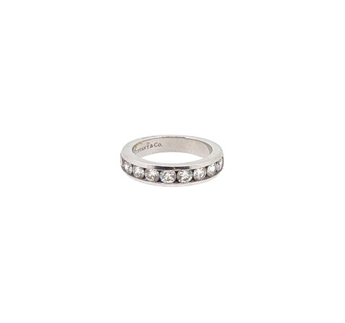 Lot 214 - Tiffany & Co - A diamond set half hoop style ring