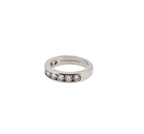 Lot 214 - Tiffany & Co - A diamond set half hoop style ring