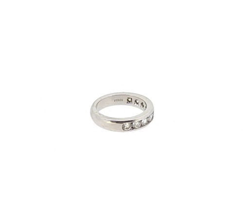 Lot 214 - Tiffany & Co - A diamond set half hoop style ring