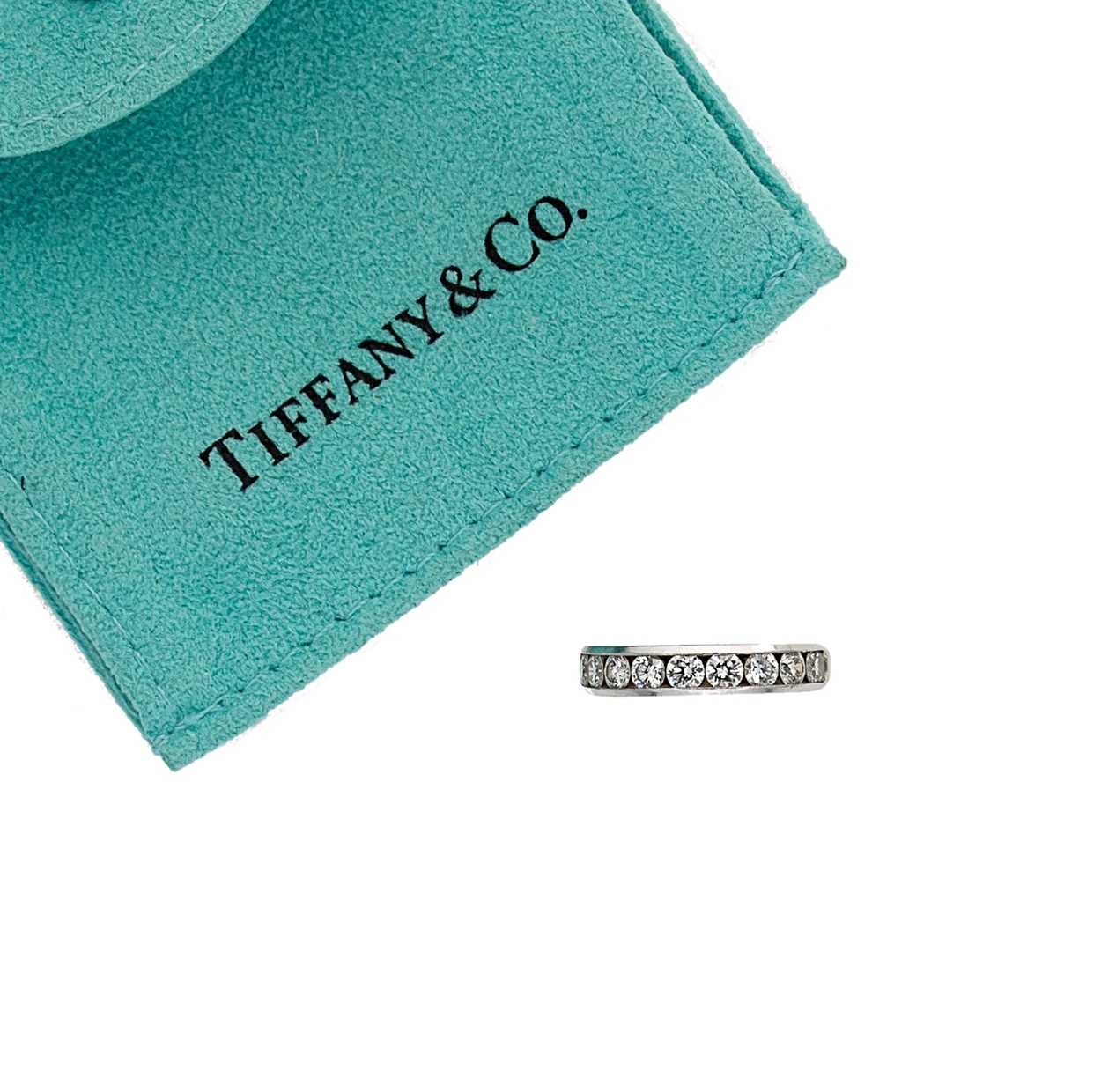 Lot 214 - Tiffany & Co - A diamond set half hoop style ring