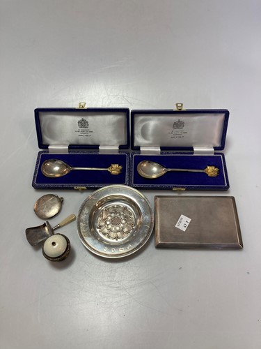 Lot 243 - A silver pocket cigarette case, a silver...