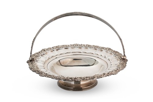 Lot 520 - A George IV silver swing handled cake basket
