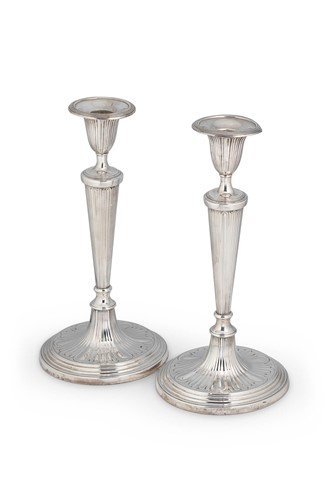 Lot 486 - A pair of George III 18th century silver candlesticks