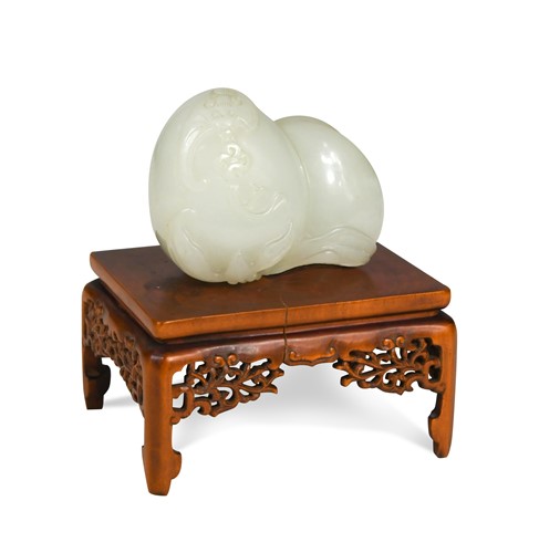 Lot 72 - A Chinese jade carving of two peaches, Qing Dynasty, 18/19th century