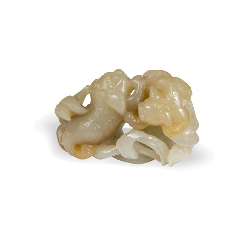 Lot 71 - A Chinese carved jade fo dog pebble, Qing Dynasty, 19th century