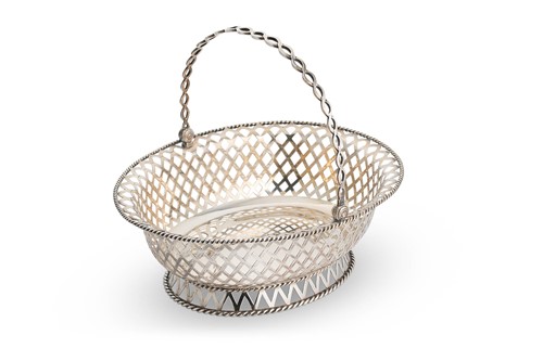 Lot 609 - A George V silver swing handled bread basket