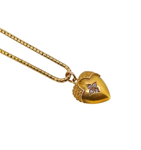 Lot 124 - A diamond set heart pendant and chain