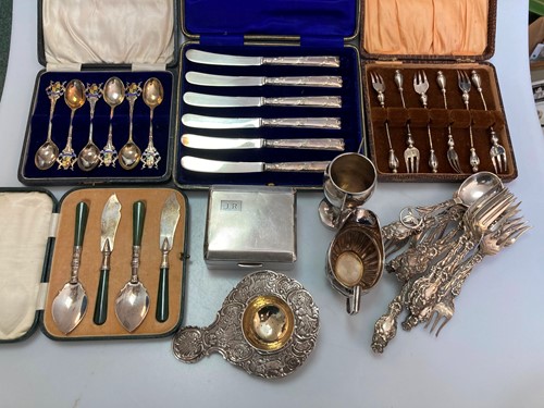 Lot 232 - A collection of silverware including a tea...