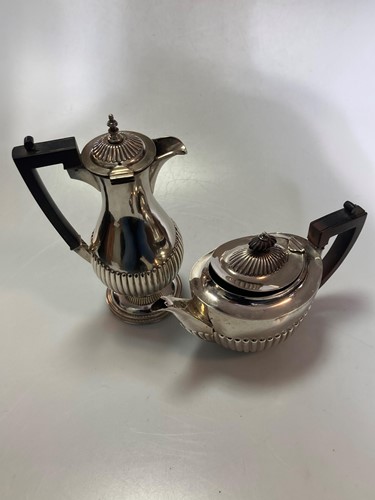 Lot 242 - A silver teapot and a silver plated hot water...
