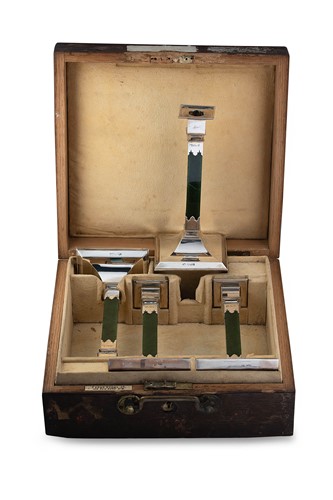 Lot 592 - A set of four Edward VII silver and nephrite candlesticks in a fitted travelling case
