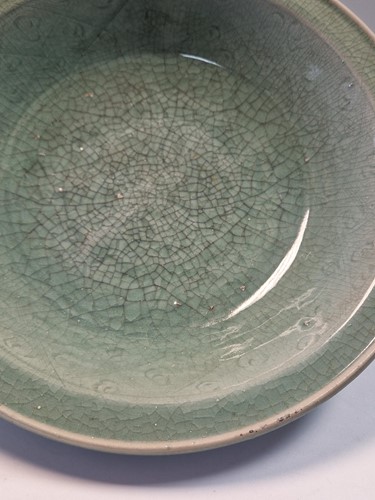 Lot 56 - A Chinese Longquan celadon dish, Ming Dynasty (1368-1644)
