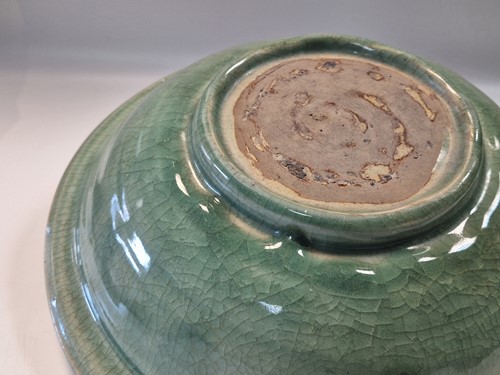 Lot 56 - A Chinese Longquan celadon dish, Ming Dynasty (1368-1644)