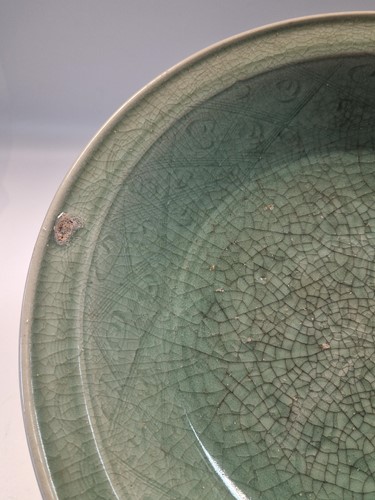 Lot 56 - A Chinese Longquan celadon dish, Ming Dynasty (1368-1644)