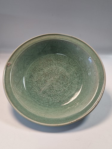 Lot 56 - A Chinese Longquan celadon dish, Ming Dynasty (1368-1644)