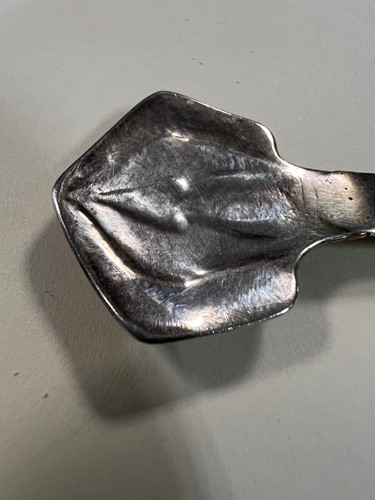 Lot 395 - Two early 20th century silver tea strainers