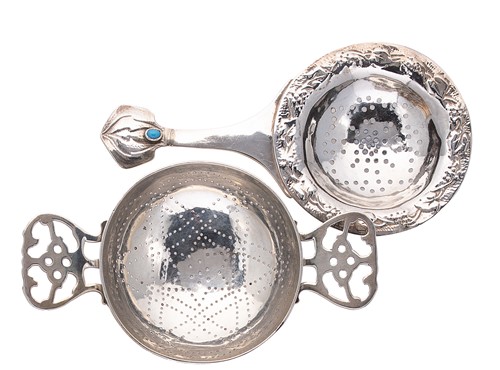 Lot 395 - Two early 20th century silver tea strainers