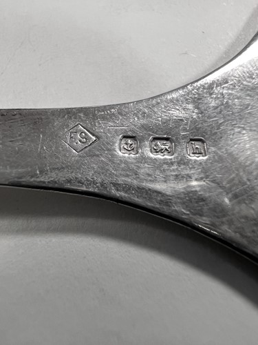 Lot 395 - Two early 20th century silver tea strainers