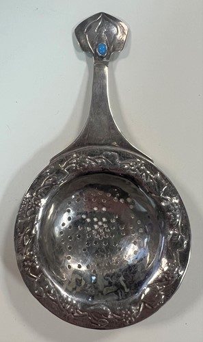 Lot 395 - Two early 20th century silver tea strainers