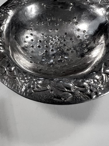 Lot 395 - Two early 20th century silver tea strainers