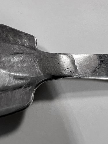 Lot 395 - Two early 20th century silver tea strainers