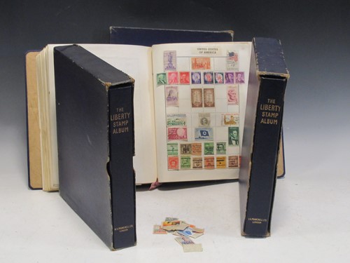 Lot 65 - Three Liberty stamp albums, to George VI, well...
