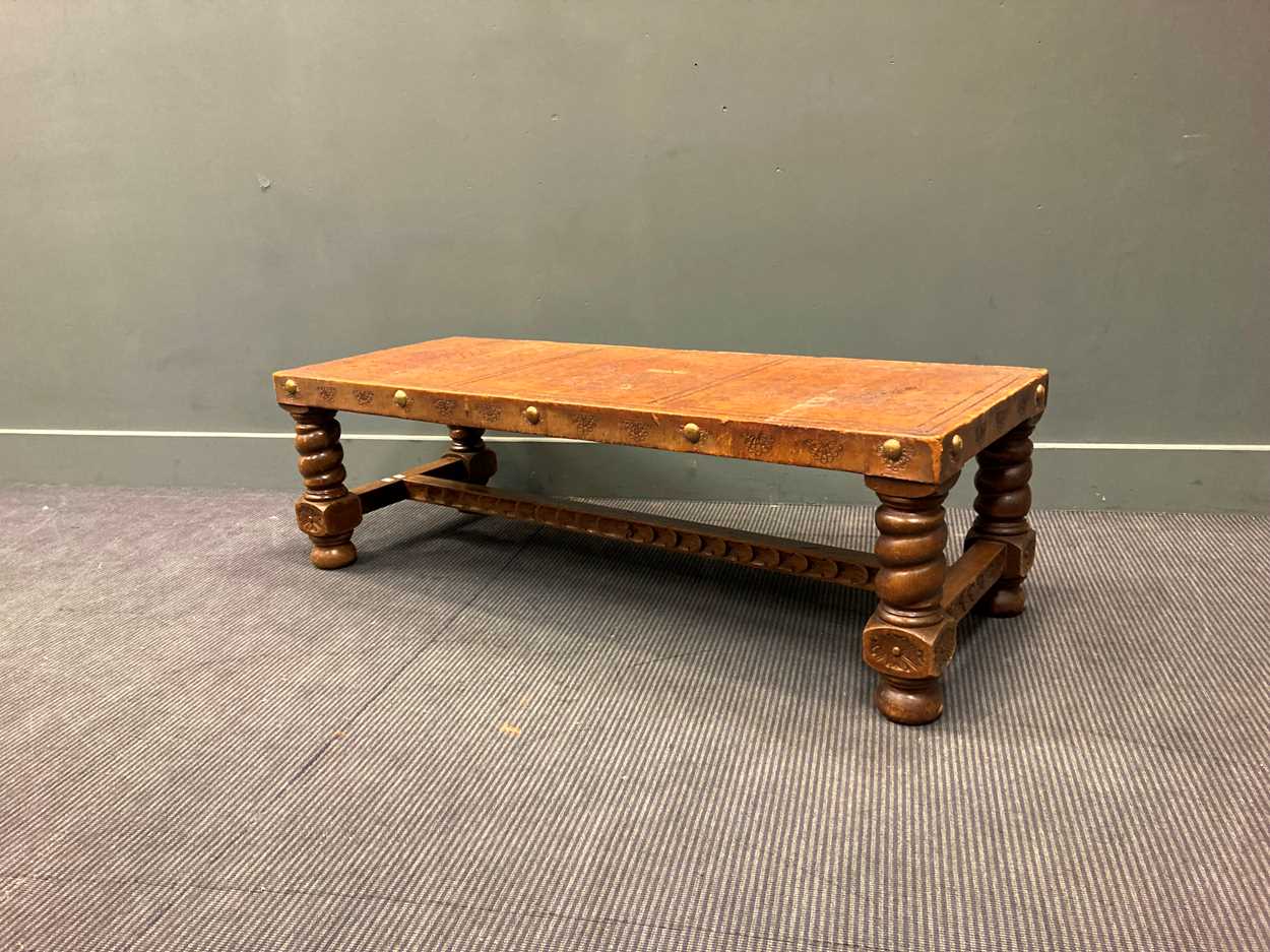 Lot 381 - Leather barely twist coffee table 40 x 131 x 51cm