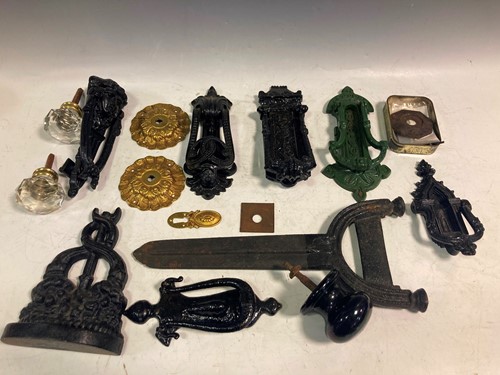 Lot 66 - Six painted iron door knockers, a foot scraper,...