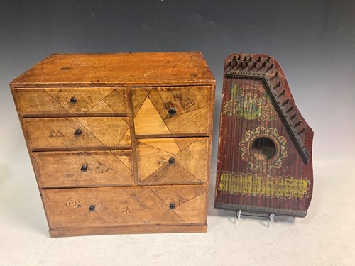 Lot 12 - A small parquetry inlaid chest of drawers,...