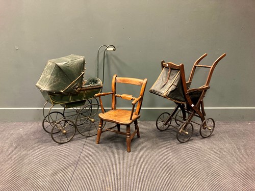 Lot 110 - A Victorian style green painted dolls pram...