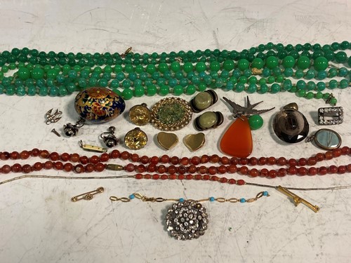 Lot 180 - A collection of beads and costume jewellery,...