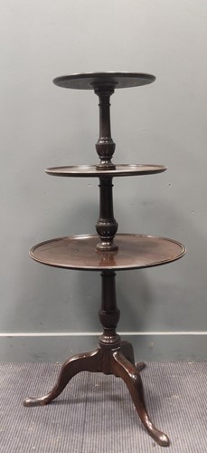 Lot 307 - A George III mahogany dumb waiter, the three...