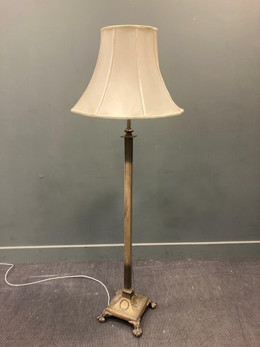 Lot 593 - A Neo-classical style polished steel standard...