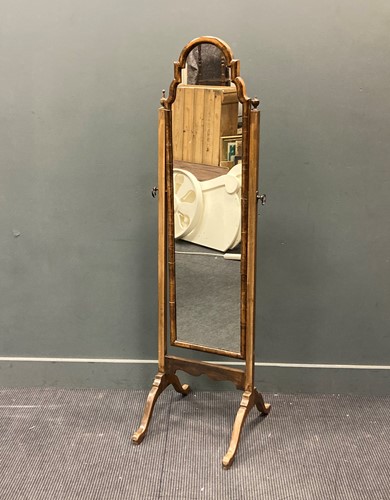 Lot 485 - A Queen Anne style walnut framed cheval mirror...