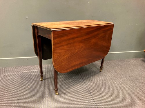 Lot 563 - A late 19th century mahogany drop leaf table...