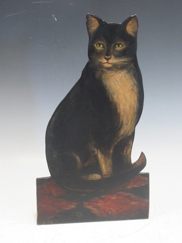 Lot 121 - A painted wooden doorstop of a cat, 41.5cm high