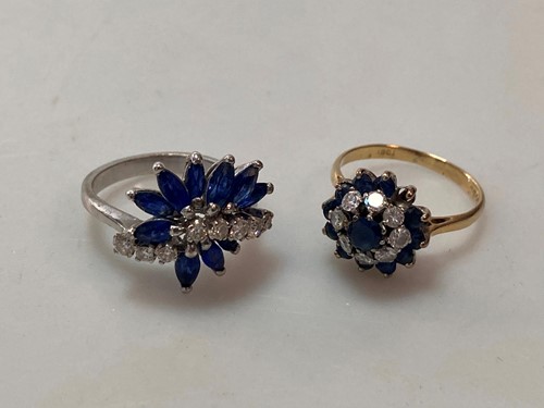 Lot 213 - A hallmarked 18ct gold diamond and sapphire...