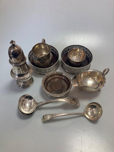 Lot 251 - A silver caster, a silver sauce boat, a silver...
