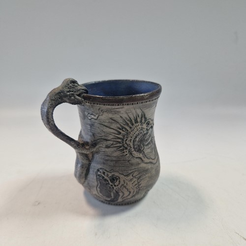 Lot 36 - Robert Wallace Martin for the Martin Brothers, a small stoneware Christening mug