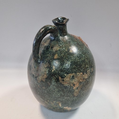 Lot 37 - Robert Wallace Martin for the Martin Brothers, a large bellied jug, circa 1896